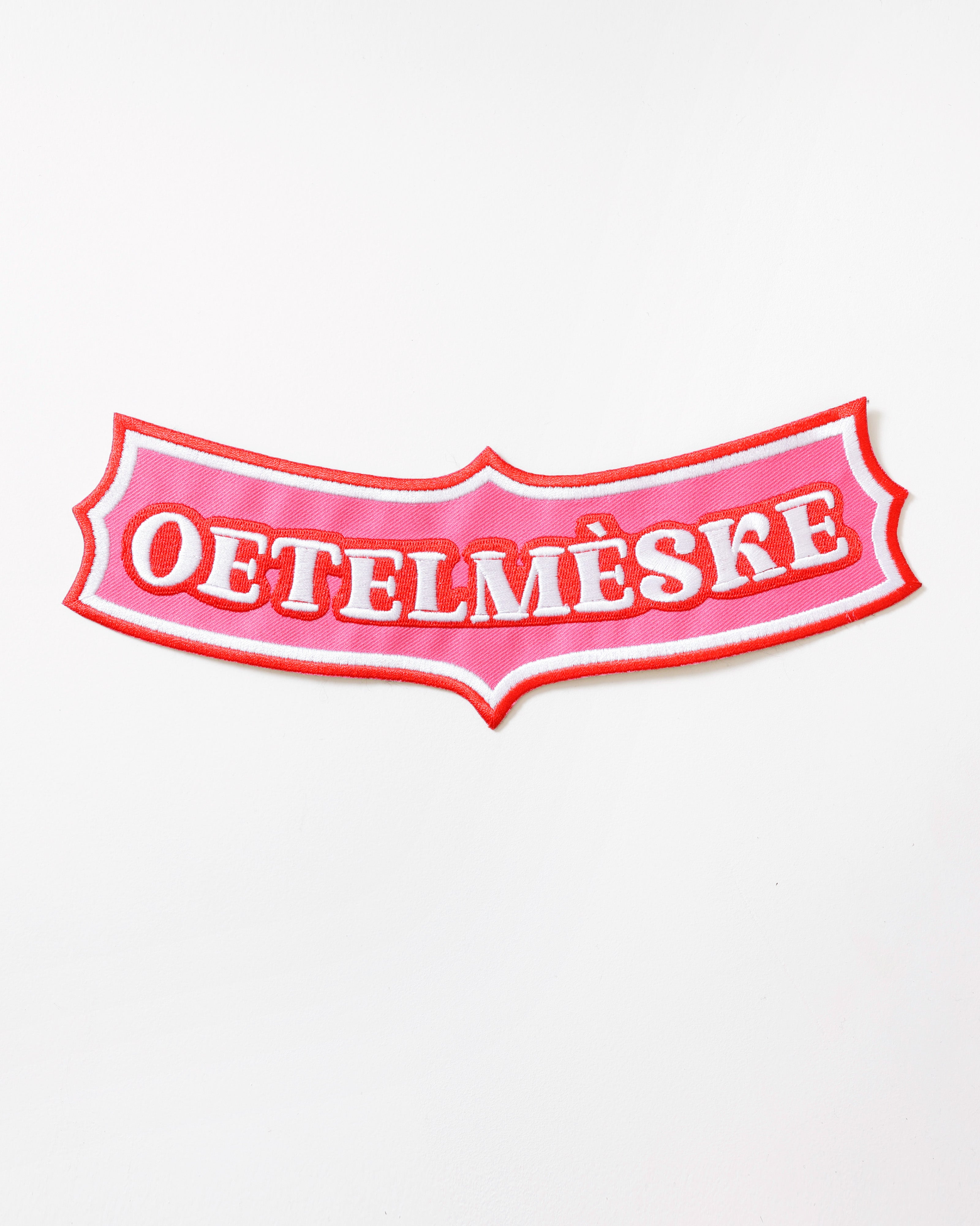 Rugembleem Oetelmèske In Roze – Boog onder