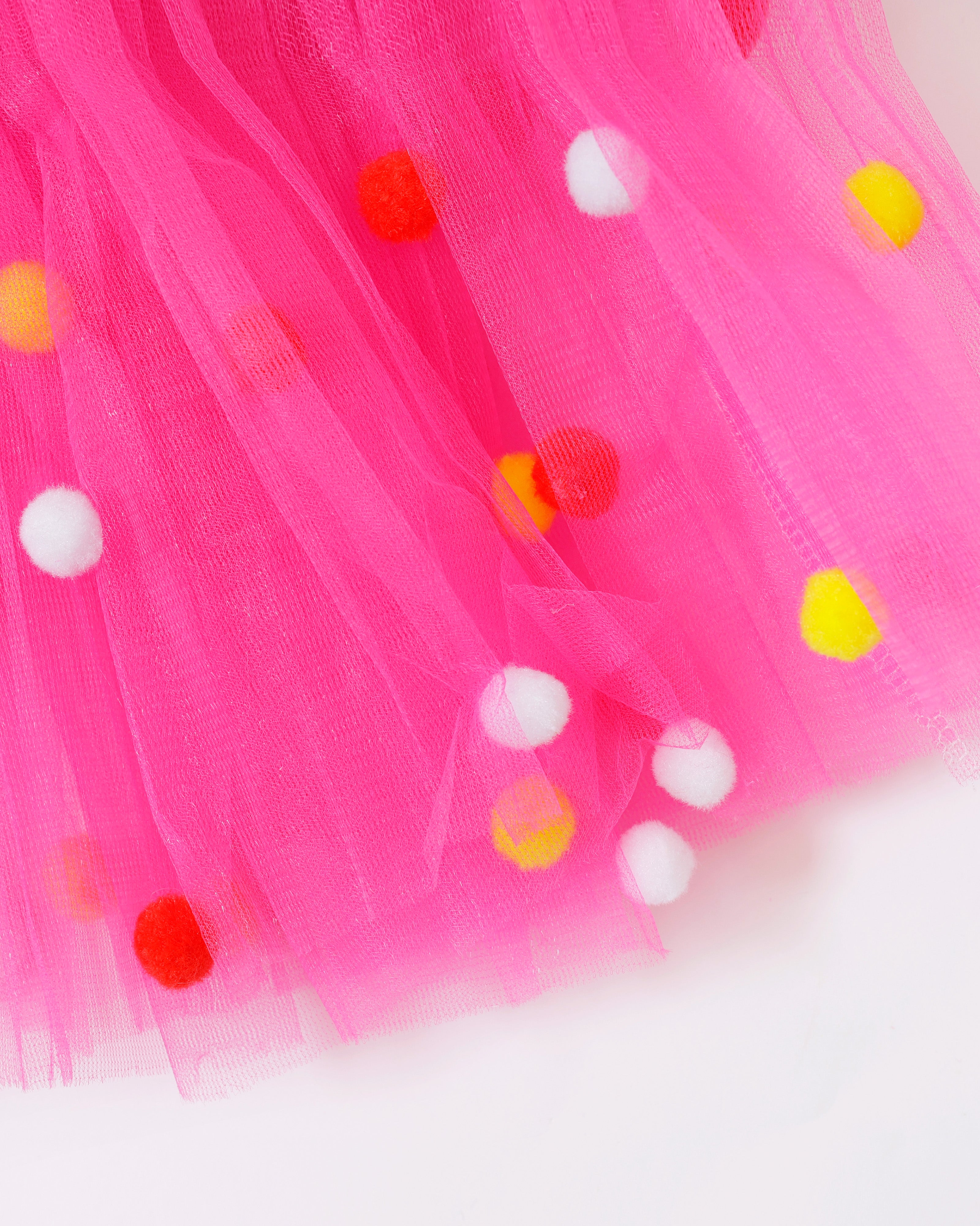 Kinder tule rokje roze met rood-wit-gele pompoms