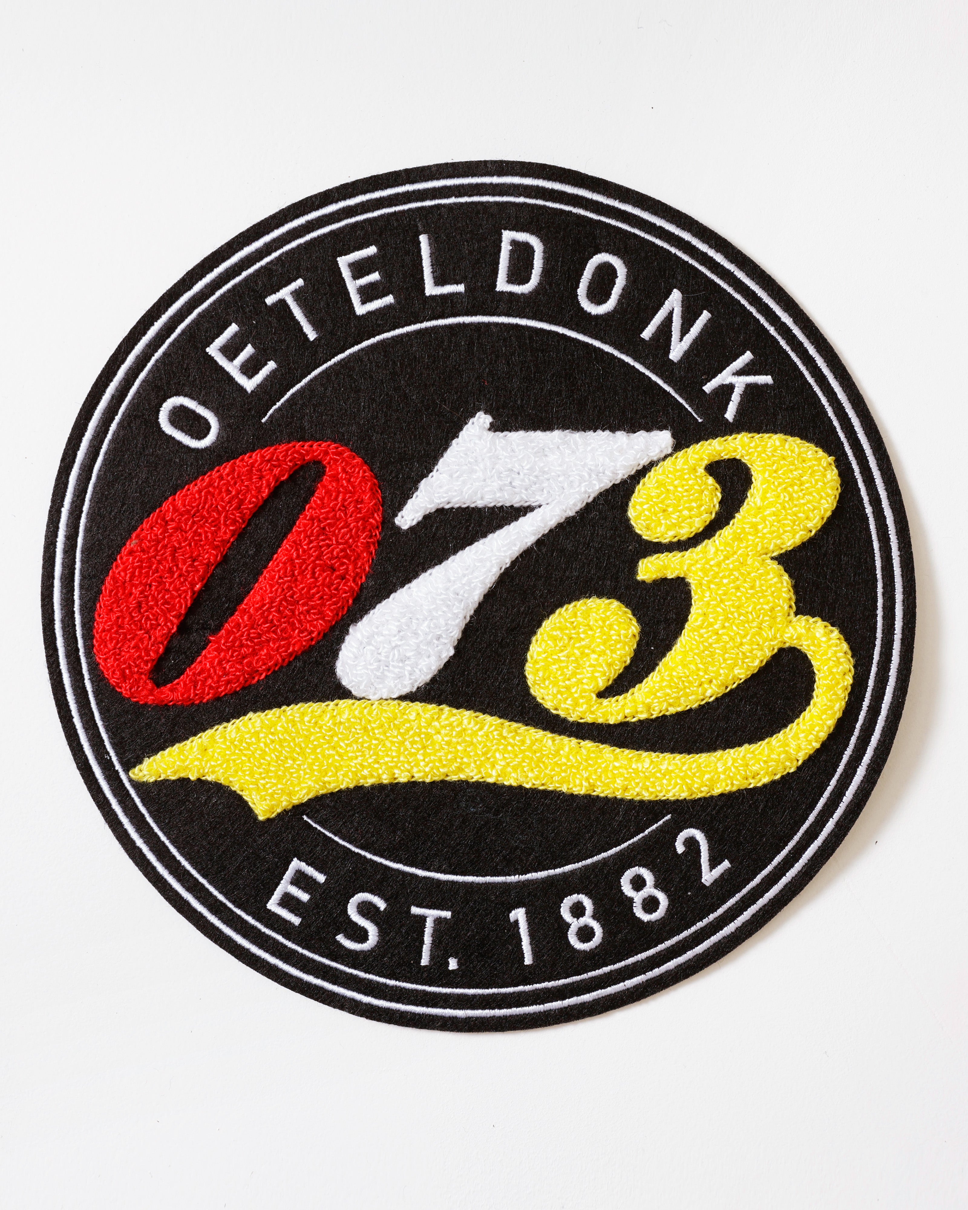 Oeteldonks Rugembleem zwarte cirkel met 073 in badstof