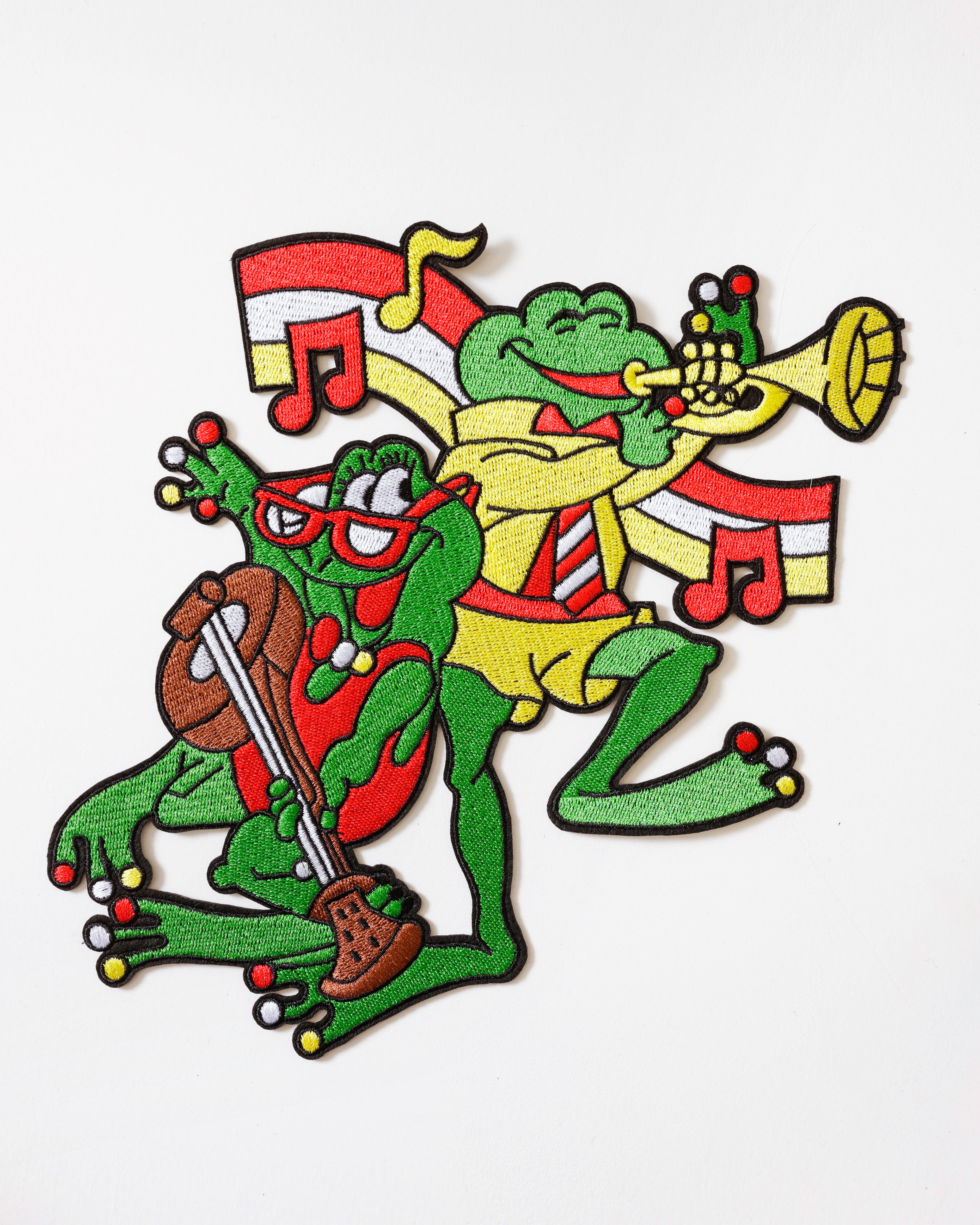 Rugembleem Oeteldonk Muzikale Kikkers – trompet & viool