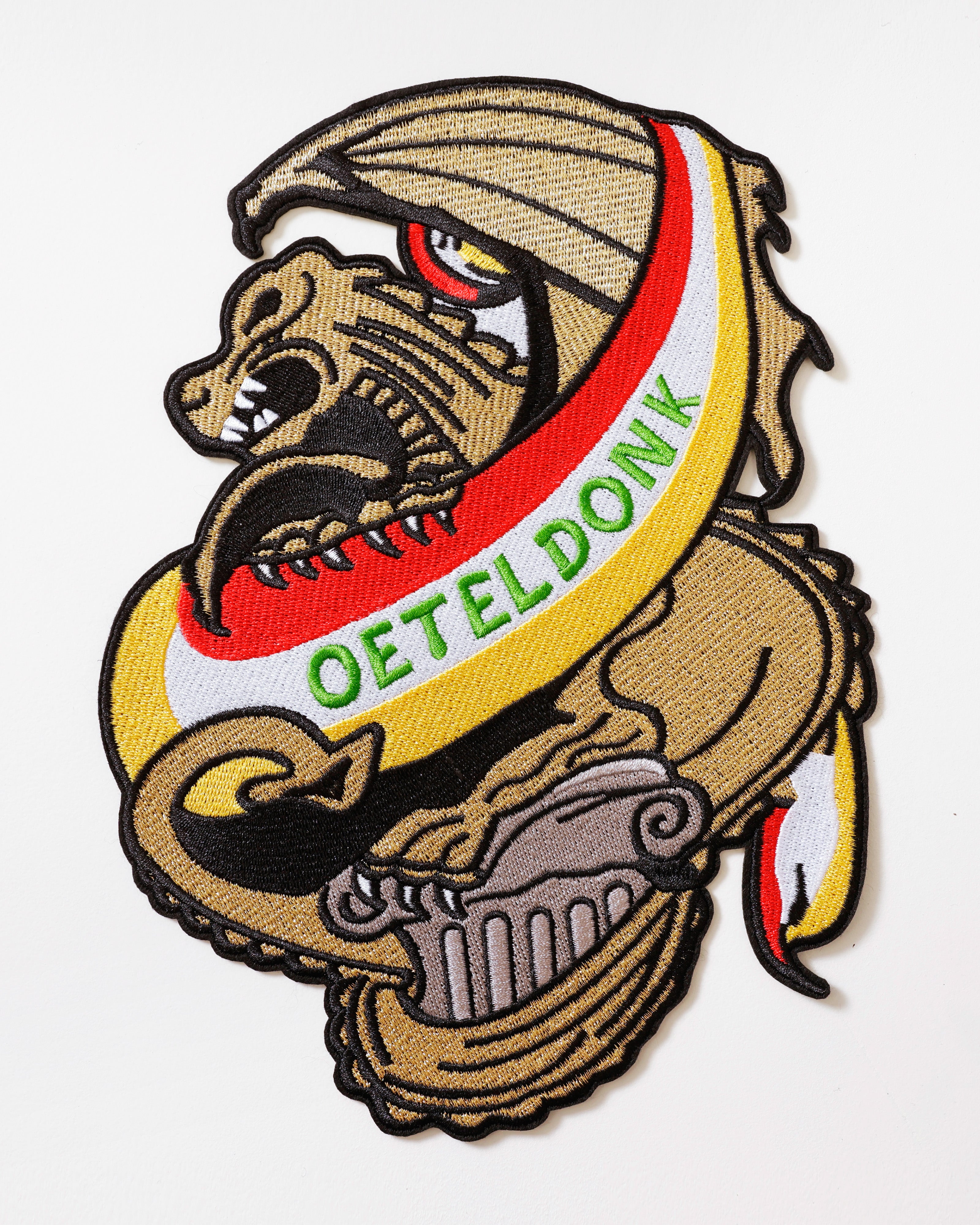 Rugembleem Bossche draak goud – Oeteldonk rood wit geel